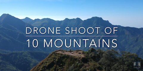 DRONE SHOT OF 10 MOUNTAIN IN TROPICAL COUNTRIES SOUTH EAST ASIA