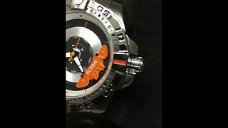 orange caliper on wheel automatic watch stainless steel bracelet