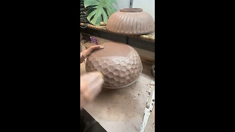 Carving a circular texture into this leather hard pottery bowl!