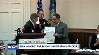 Delivery man receives top honor for heroic actions that saved sheriff
