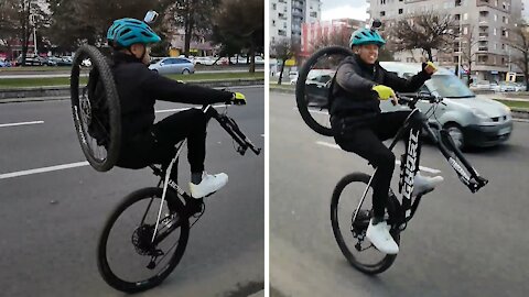 Guy with only one tire rides bike like a unicycle