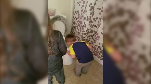 Dad Pretends To Be Stuck In The Toilet