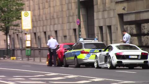 Exotic cars burnout through busy city streets, receive instant karma