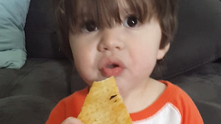 An Adorable Boy Steals A Pizza Slice