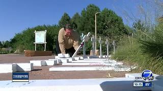 Man sets up memorial for victims of Aurora shooting