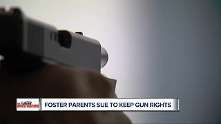 Foster parents sue over gun rights