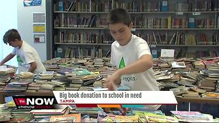 Kids helping kids with big book donation