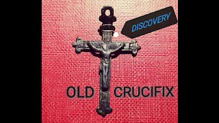 I find an ancient crucifix