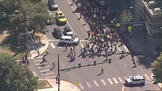 ICE protesters march down Colfax Avenue