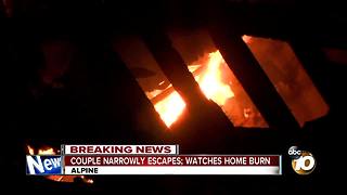 Couple narrowly escapes; watches home burn