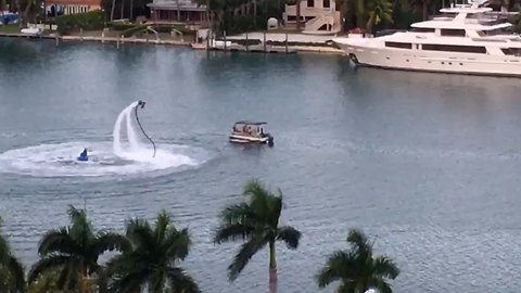 Man on water-powered jetpack performs for cruise ship passengers