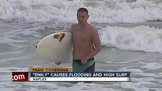 beachgoers brave rough surf