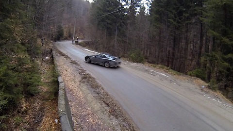 Thrill-Seeking Professional Driver Pulls Drifts On Mountain Road