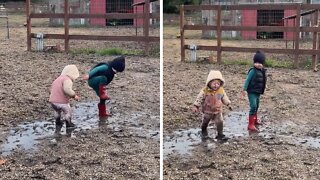Loving Siblings Adorably Play In The Mud
