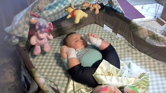 Baby sleeps with sales legs up