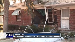 Suspect arrested after vehicle hits home in Detroit