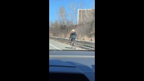 Cyclist On Highway