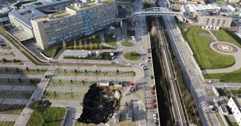 Massive sinkhole swallows at least 3 cars outside hospital in southern Italy