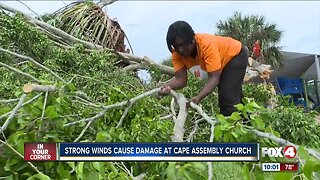Strong winds knock trees down near a church playground