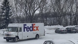 FedEx truck sliding around in snow