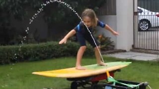 Boy takes to the surf in his own backyard!