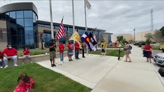 Native American veteran, supporters march to Police HQ, ask that flag thief be charged with hate crime