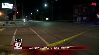 Man crossing street hit by truck, critically injured