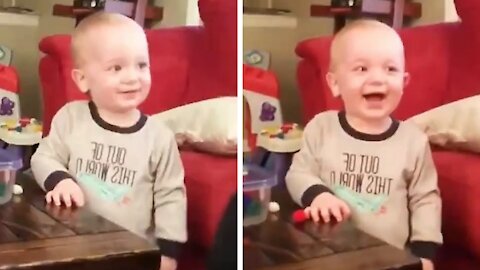 Cute Baby can't control the giggles when he sees his mommy sneezing