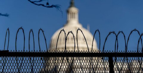 Heavily fortified statehouses around U.S. see small protests