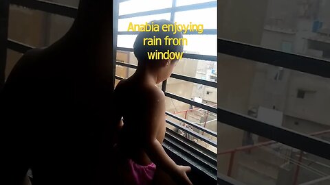 Anabia enjoying rain from window