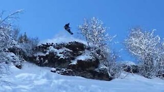 Spectacular snowboard jump ends with terrible landing!