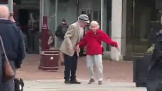 Elderly couple demonstrate true love by dancing in the street