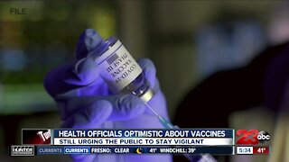 Health officials optimistic about vaccines, but still urging the public to stay vigilant