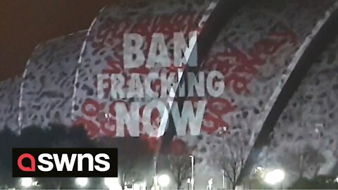 Eco-activists project 'BAN FRACKING NOW' onto COP26 SEC building