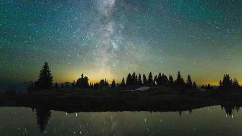 calming inspirational music with time lapse of stars reflecting in water