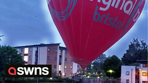 Dramatic footage shows hot air balloon landing in car park after nearly hitting houses