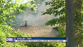 Firefighters face flames inside hoarder home