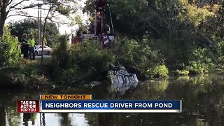 Neighbors rescue driver from car submerged in water on Thanksgiving