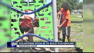 Volunteers help build first-ever playground for Mountain Home school