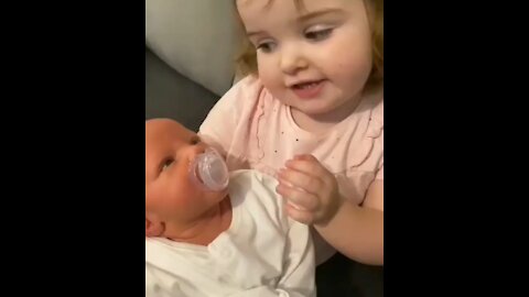 Beautiful little sister sing to her brother John