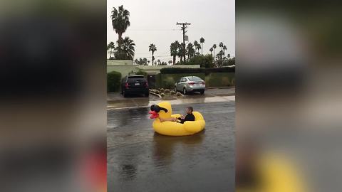 Boy Rides Huge Inflatable Rubber Duck In A Middle Of The Street