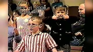 Young Girl In Choir Makes Crazy Faces