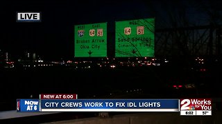 Crews work on street lights along IDL in downtown Tulsa