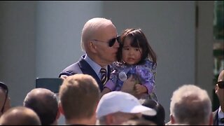 Biden Sniffs A Small Child