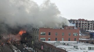 Firefighters battle massive four-alarm fire on Main Street