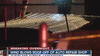 Roof blows off auto repair shop, causes outages