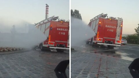 Firetruck in Slovenia helps water the flowers