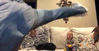 Dad's karate moves make baby son laugh