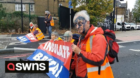 Protestors covered in Ink by motorists as they block the A40
