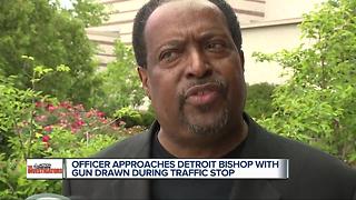 DPD officer approaches bishop with gun drawn during a traffic stop